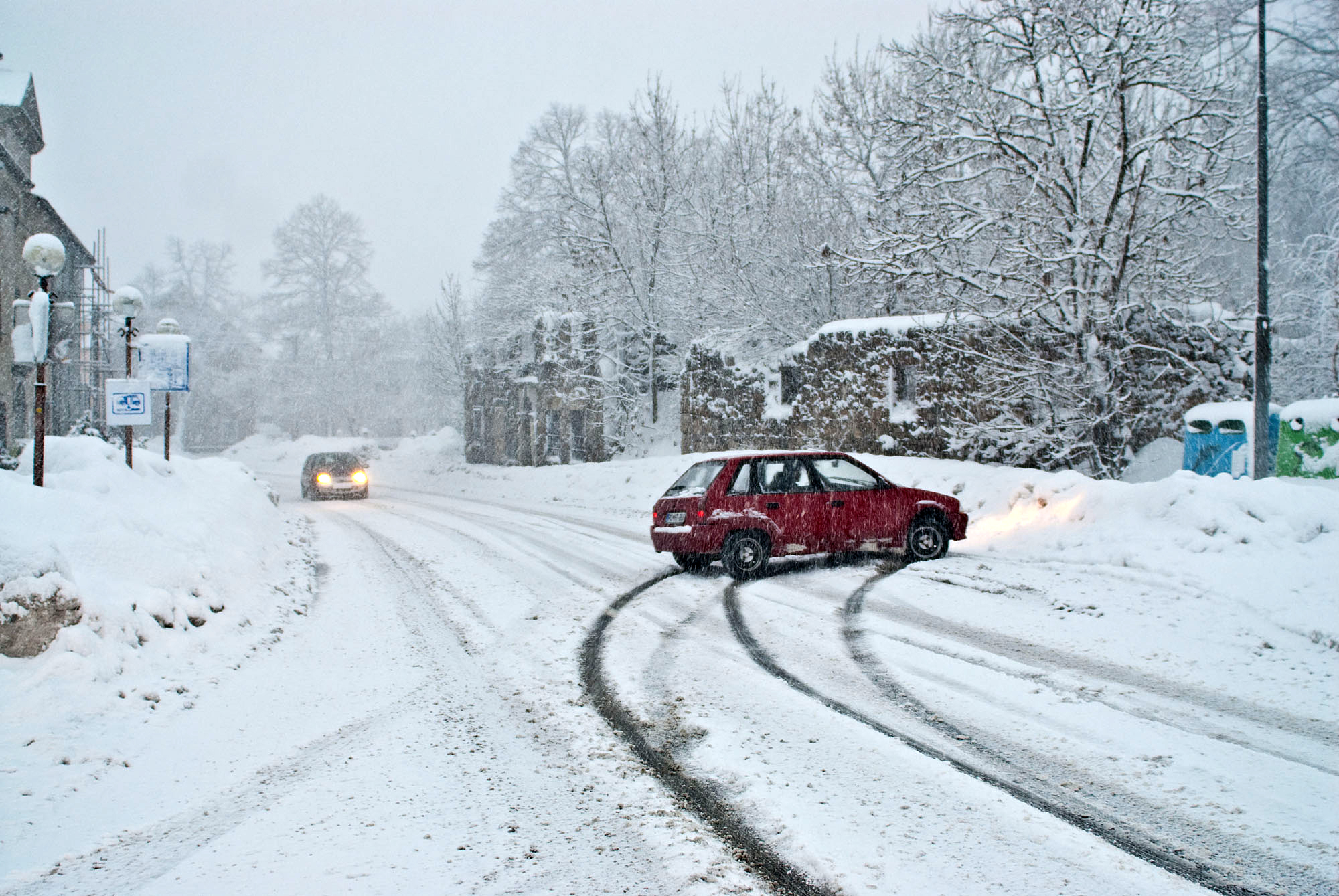 car slide out of snow road