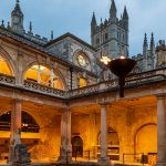 Restored ancient Roman Baths in the evening in Bath town.